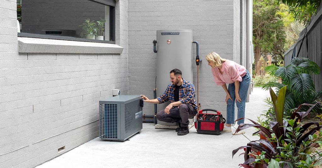 Rheem AmbiPower 5kW Split Heat Pump: Plumber and homeowner setting up the system.